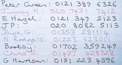 A list of handwritten telephone numbers